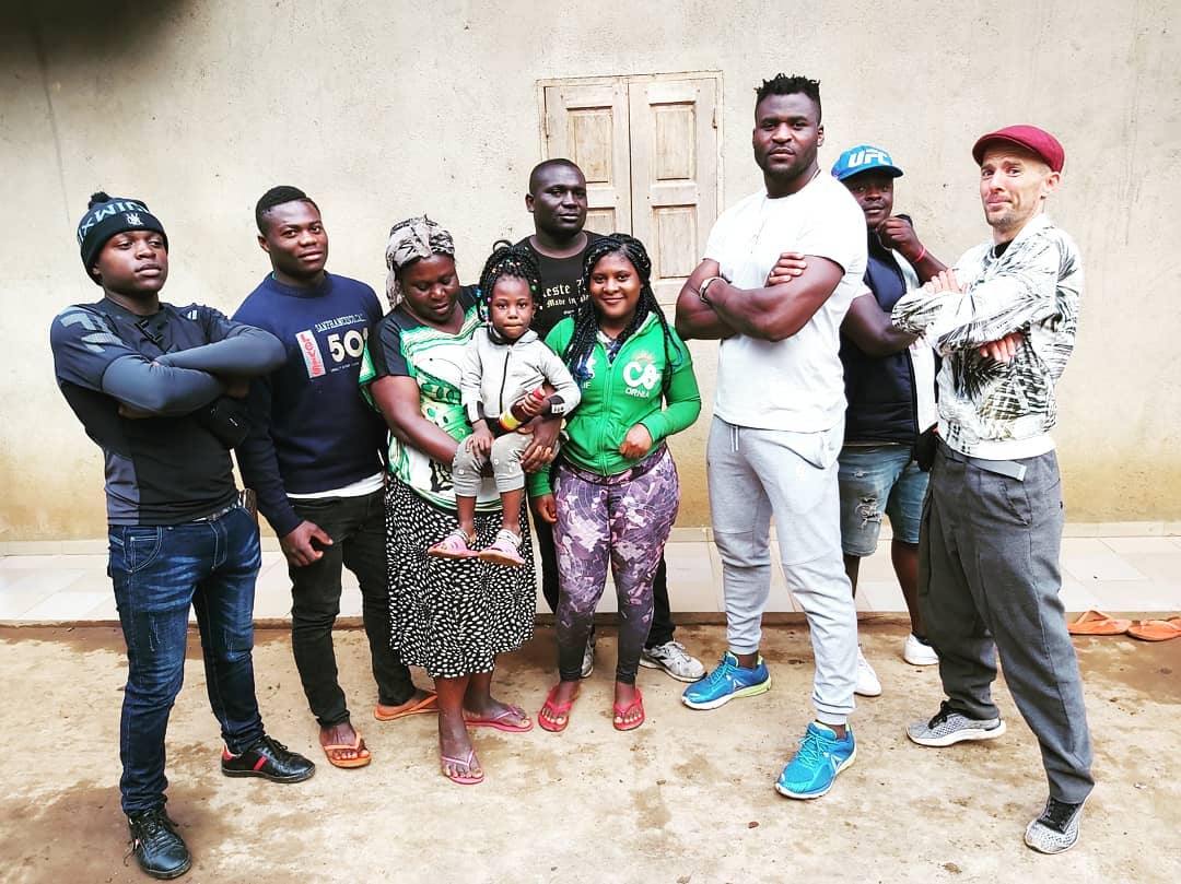 4D Martial Arts Berkhamsted head coach Zak Brophy with Francis Ngannou and his family in cameroon